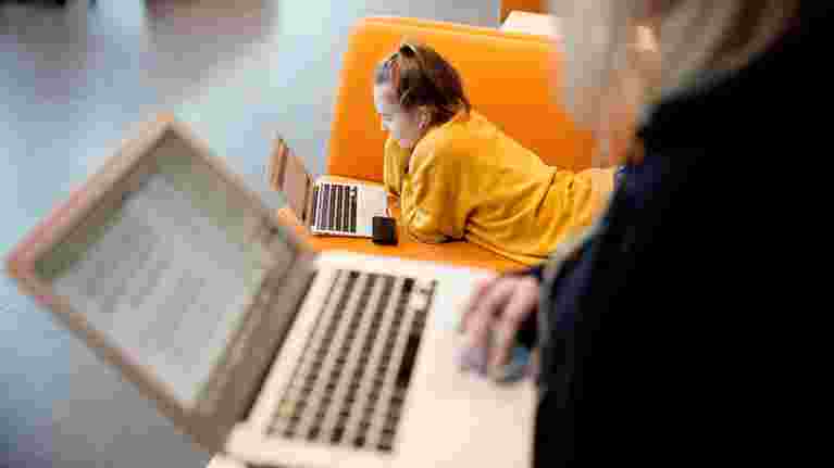 Student reading on laptop.