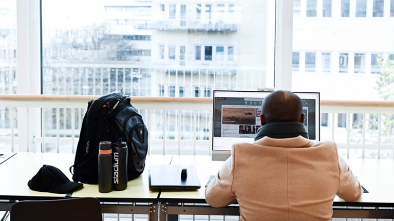 Student browsing on computer.