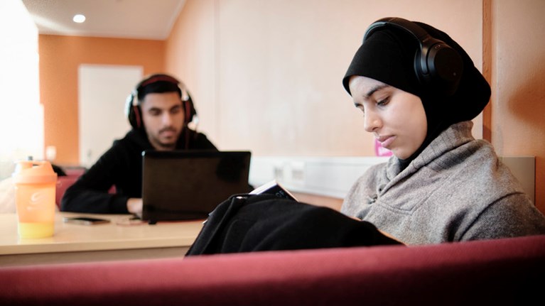 Focused students with headphones.