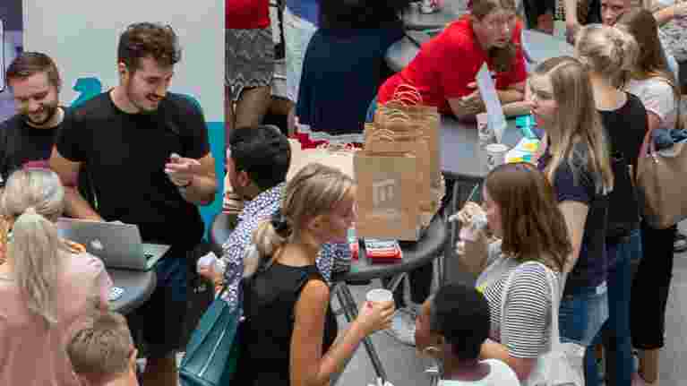 Students mingeling at event.