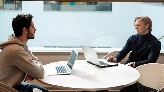 Two students listening to each other.