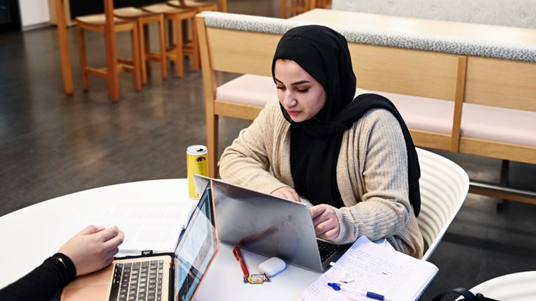 Student with laptop.